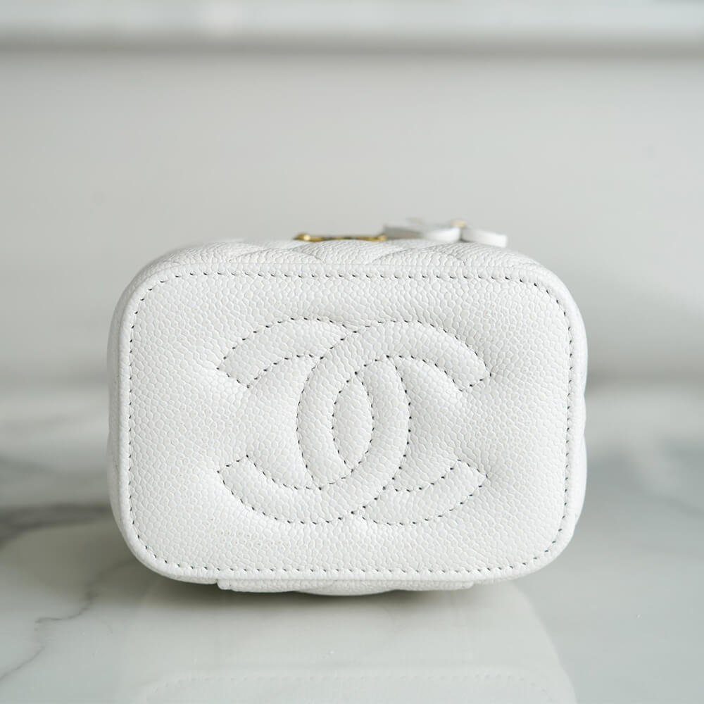 Ch*el small gold ball makeup bag