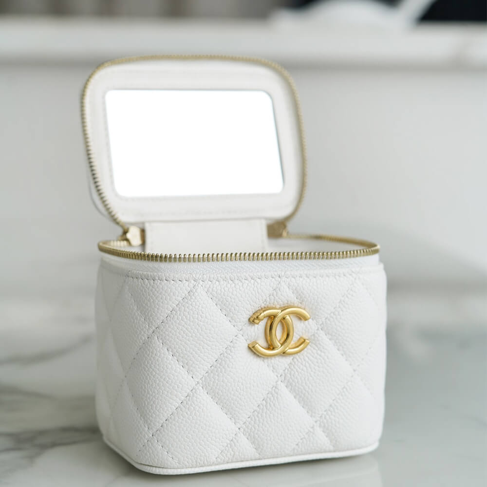 Ch*el small gold ball makeup bag